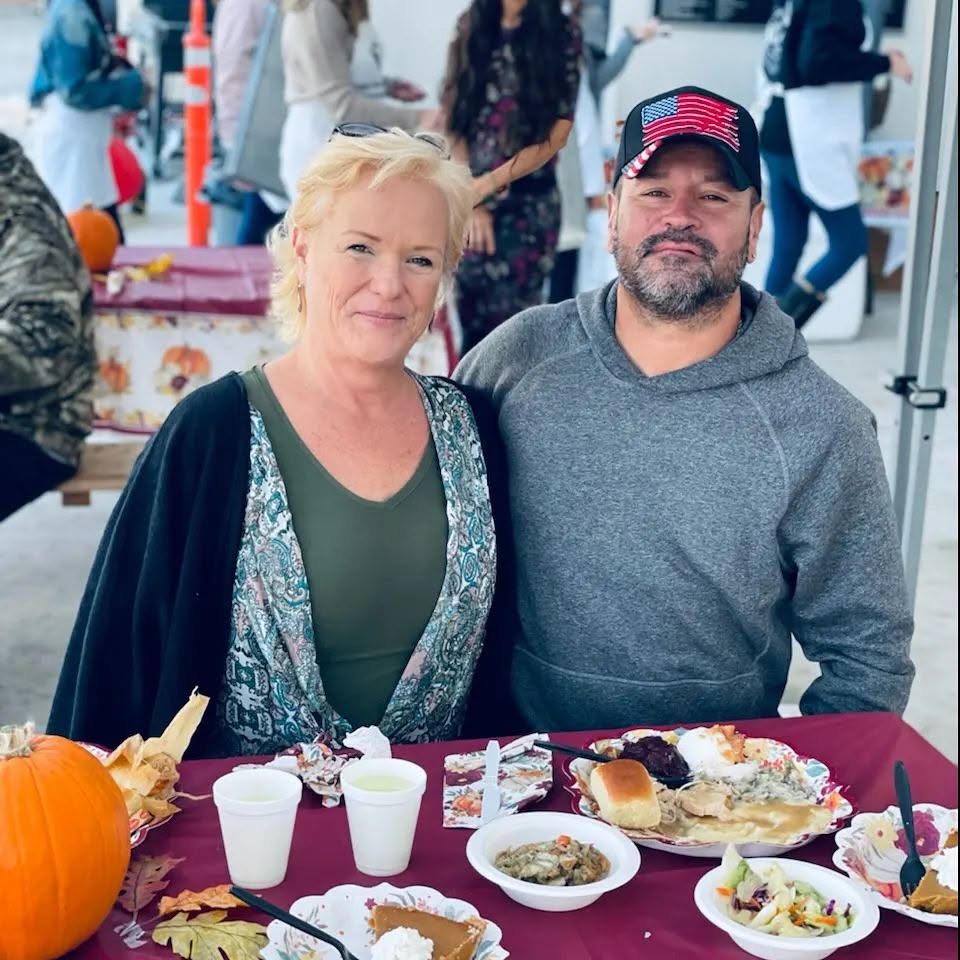 Two people seated together at a shared meal.